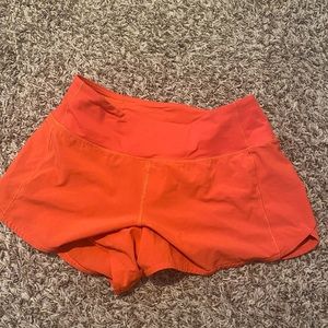 Used Lululemon Red Hotty Hot Shorts. Size 6, 4” LR